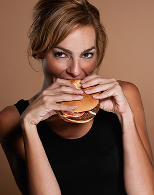 Woman eating burger