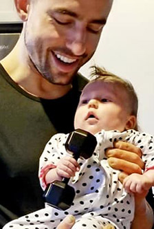 Man holding baby in his hands