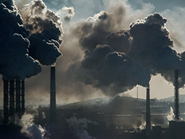 chimnies blowing smoke outside