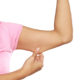 An image of a woman pinching her underarm flab.