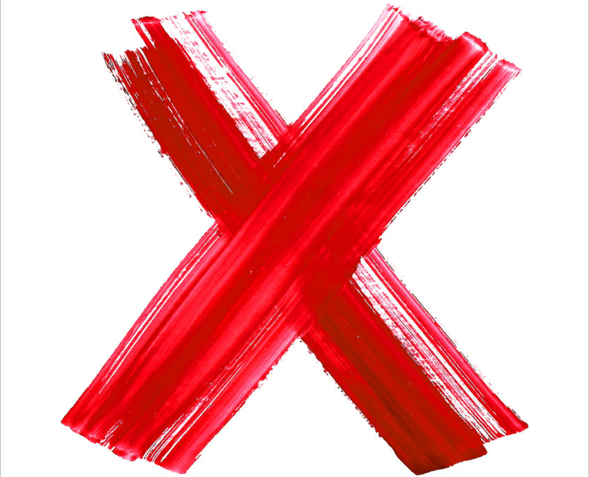 An image of a big red painted X.