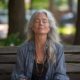 An image of a woman meditating in the park to regulate your hormones.