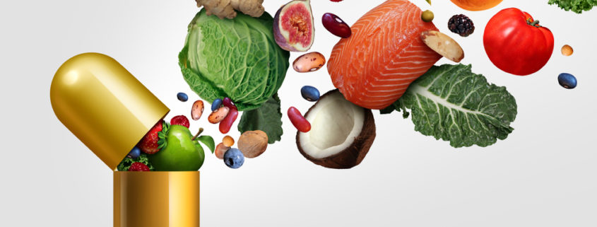 A graphical image of various healthy foods, like salmon and coconut, pouring into a large golden capsule.