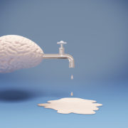 A graphical image of a human brain with a faucet attached to it, dripping liquid on the floor.